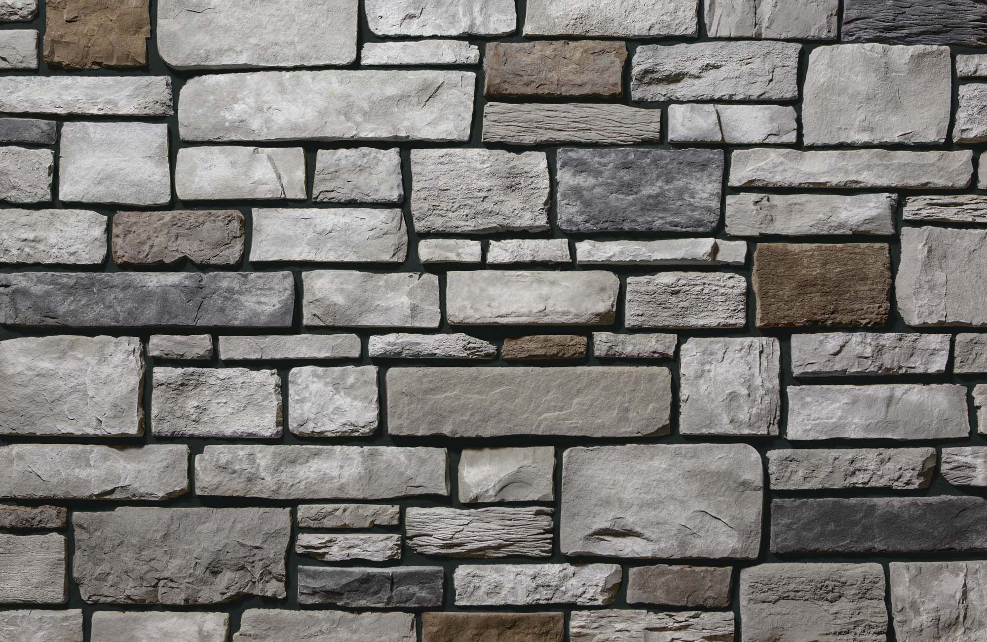 Add depth and detail to your home office with thin stone veneer and black grout.